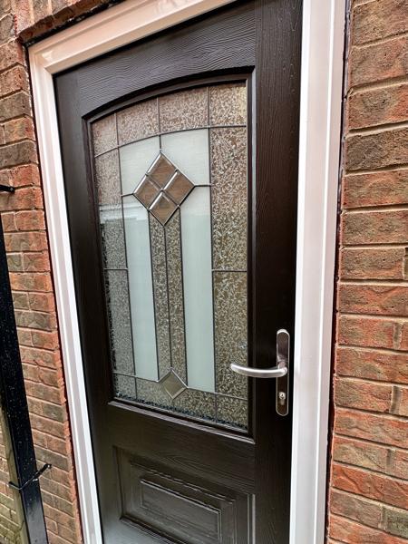 Black composite door fitted by Bleaklow Windows