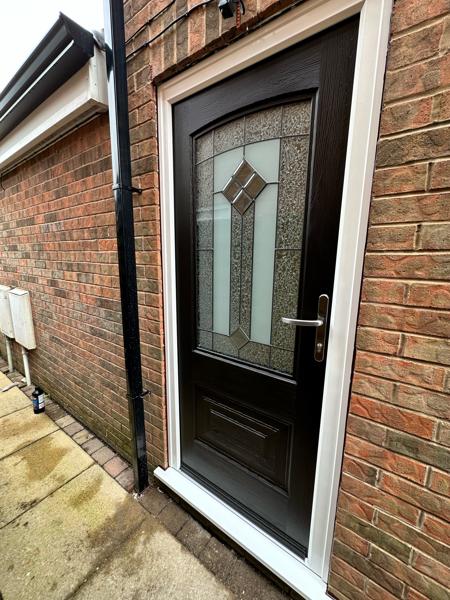 Black composite door fitted by Bleaklow Windows