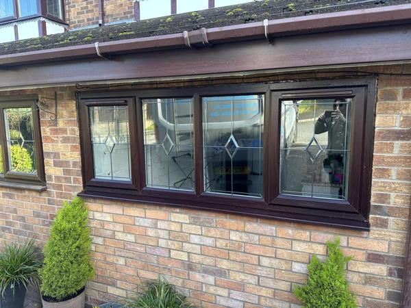 Brown uPVC windows on a bungalow fitted by Bleaklow Windows